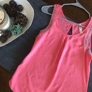 Pink sleeveless top with beaded details